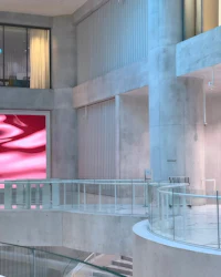a large screen in the lobby of a building