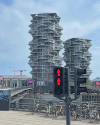 a 3d model of a building with bicycles in front of it