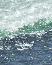a man is riding a wave in the ocean
