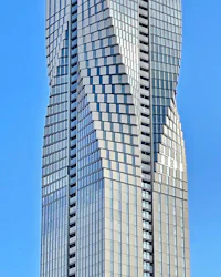 a tall building with a curved design